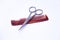 Hairdressers\' scissors and comb on a white background.