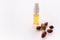 Hairloss concept. Argan seeds, oil and hair isolated on a white background