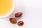 Hairloss concept. Argan seeds and oil isolated on a white background