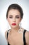 Hairstyle and make up - beautiful female art portrait with earrings. Elegance. Genuine natural brunette with jewelry