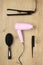 Hairstyling accessories on wooden background