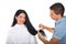 Hairstylist cutting long woman hair