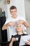 Hairstylist Cutting Woman\'s Hair In Salon