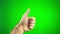 hairy hand of a man in the center of the green chroma key screen raises his finger up and holds his hand approval class
