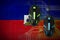 Haiti flag and two mice with backlight. Online cooperative games. Cyber sport team