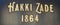 Hakki Zade was established in 1864 as a confectioner. Hakki Zade sign photographed nearby. Gold color on black surface