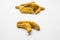 Haldi or Dried Turmeric Roots as a whole on white background