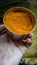 Haldi powder, Turmeric powder in hand