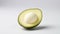 A half avocado is shown up close, highlighting the creamy texture of the white seed in the center. isolated against a