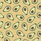 Half avocados on a yellow background. Avocado seamless pattern.