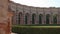 Half circle of arches and columns in Palazzo Te garden in Mantua