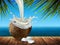 Half of the coconut milk and several pieces of walnut on the background seascape. Highly realistic illustration