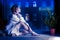 Half-dressed girl in white shirt sits on window sill