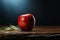 A half eaten apple sits quietly upon the tables surface