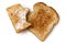 Half eaten buttered slice of whole wheat toast and whole dry slice of toast isolated on white from above.