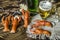 Half-empty glass with beer and a bottle of beer and salted boiled red crayfish