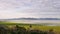 Half empty Lake George nestled between two mountain ranges