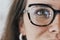Half face, eyes and woman with glasses for optical healthcare, vision or perception. Female, portrait and spectacles of