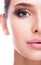 Half face female beauty portrait with aqua Limpet Shell color eye shadows, Snorkel Blue colour liner and Rose Quartz lips