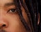 Half face portrait of african man with dreadlocks