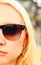 Half face portrate of fashion blond woman in sun glasses