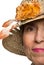 Half face senior woman with sun hat