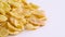 Half frame of corn flakes pile rotating on the turntable. Slowly rotating on the turntable isolated on the white color