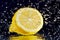 Half of lemon with stopped motion water drops