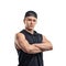 Half-length portrait of muscled young man stands with folded arms. Healthy lifestyle. Fitness and sport.