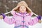 Half-length portrait of smiling little girl in pinky jacket