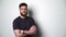 Half length portrait of young bearded hipster man smiling at camera