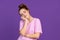 Half-length portrait of young pretty girl isolated on purple, lilac color studio background. Concept of human emotions