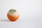 Half moldy tangerine on a white background. Place for text