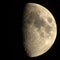 Half Moon with Craters. The Moon is an astronomical body that orbits planet Earth, being Earth`s only permanent natural satellite