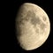 Half Moon with Craters. The Moon is an astronomical body that orbits planet Earth, being Earth`s only permanent natural satellite