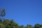 HALF MOON AND JET AIRCRAFT IN BLUE SKY