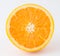 Half nontoxic orange on white background