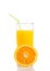Half orange in front of glass of orange juice with straw on white background