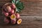 Half of passion fruit and organic passionfruit on wood basket, wooden background. Top view and Copy space