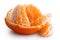 A half peeled mandarin split into segments.
