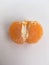 Half of peeled ripe mandarin close. Minimalistic wallpaper.