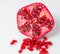 A half pomegranate with seeds (isolated)