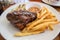 Half rack of barbecue pork ribs with french fries