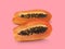 Half of ripe papaya fruit with seeds on a color background. Appetizing tropical fruit