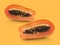 Half of ripe papaya fruit with seeds on a color background. Appetizing tropical fruit