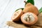 Half Santol on white wood background, Santol has sour taste