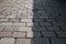 Half shaded ancient cobble stone road in Bangkok Thailand