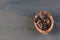 half of a split rotten walnut on a brown concrete or slate background. The concept of a walnut background. top view. A