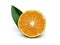 Half tangerine with leaf on white background