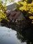 Half-timbered house mill Blautopfhaus at blue turquoise freshwater spring Blautopf in Blaubeuren Baden-Wuerttemberg